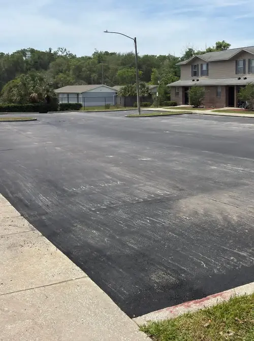 Finished asphalt driveway at a residential property in DeLand, Florida