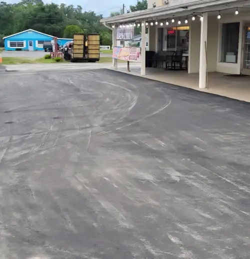 Repaired and repaved commercial lot in front of an open storefront in Central Florida